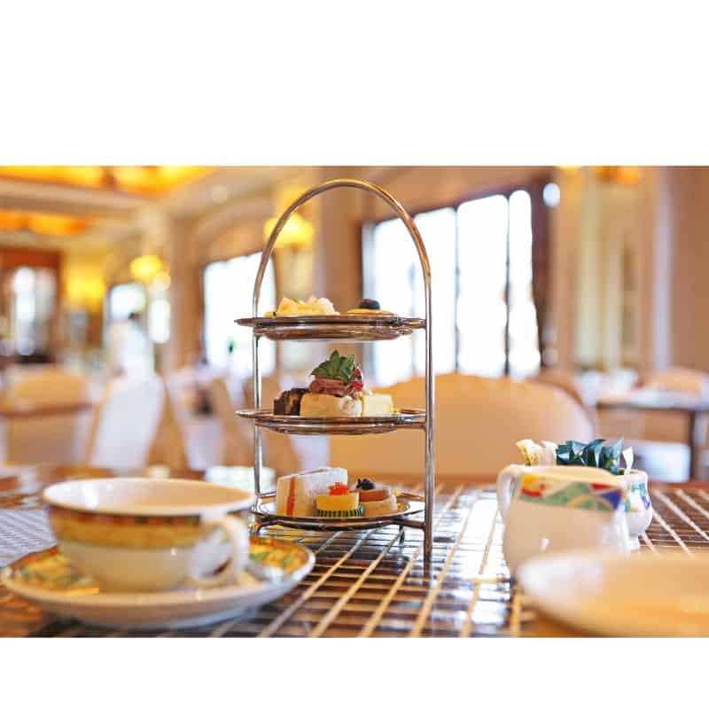 Glasgow High Tea with pastries and tea cups in a dining room 