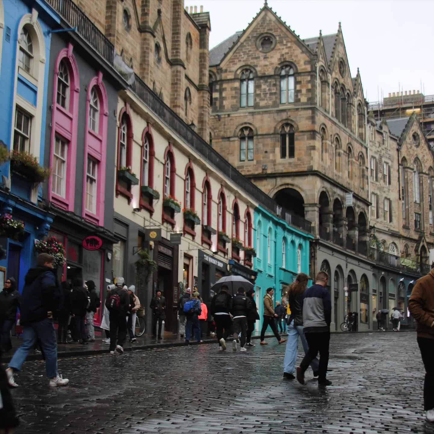 Victoria's Street with cobblestone curvy walkway, colorful store fronts and people shopping