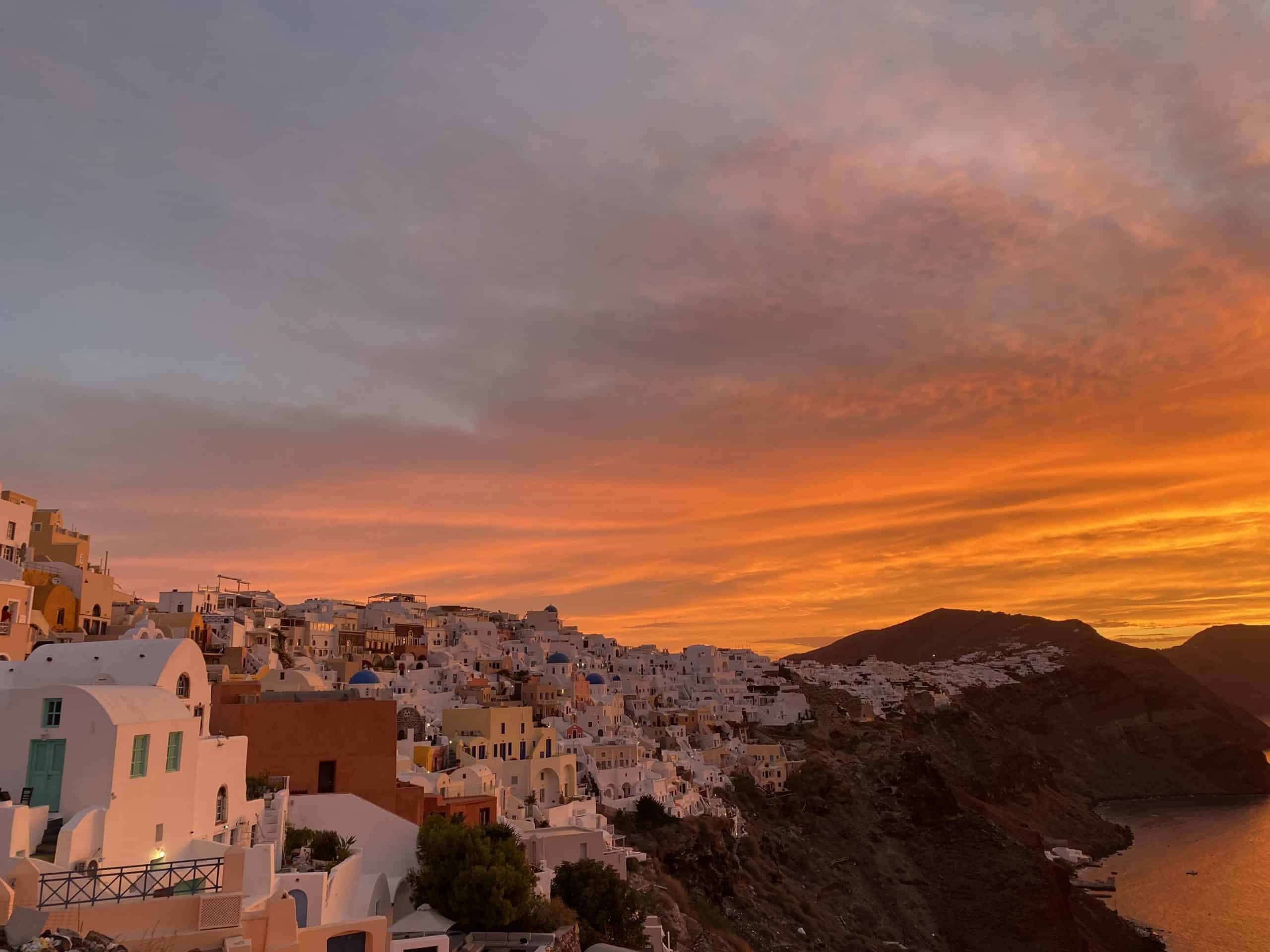 Sunrise with buildings and island in orange and yellow colors
