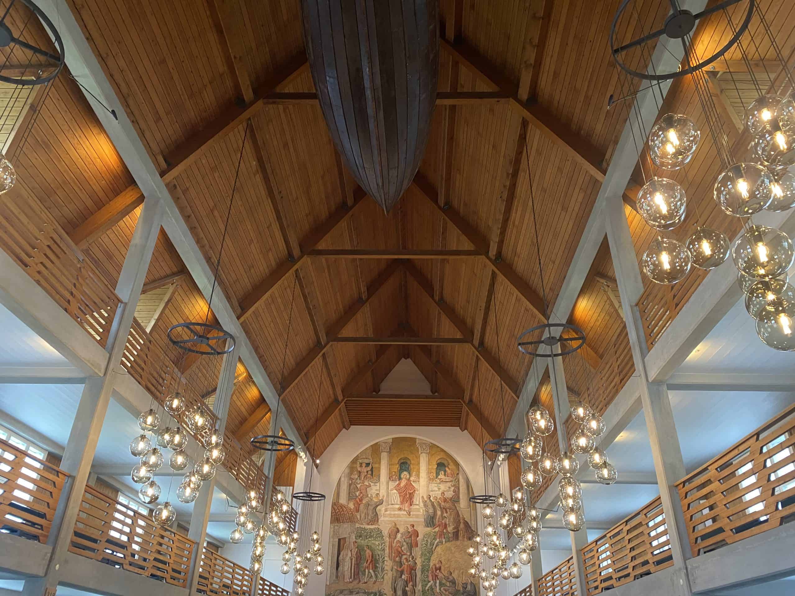 Wooden church with boat hanging from ceiling and bubble lights hanging 