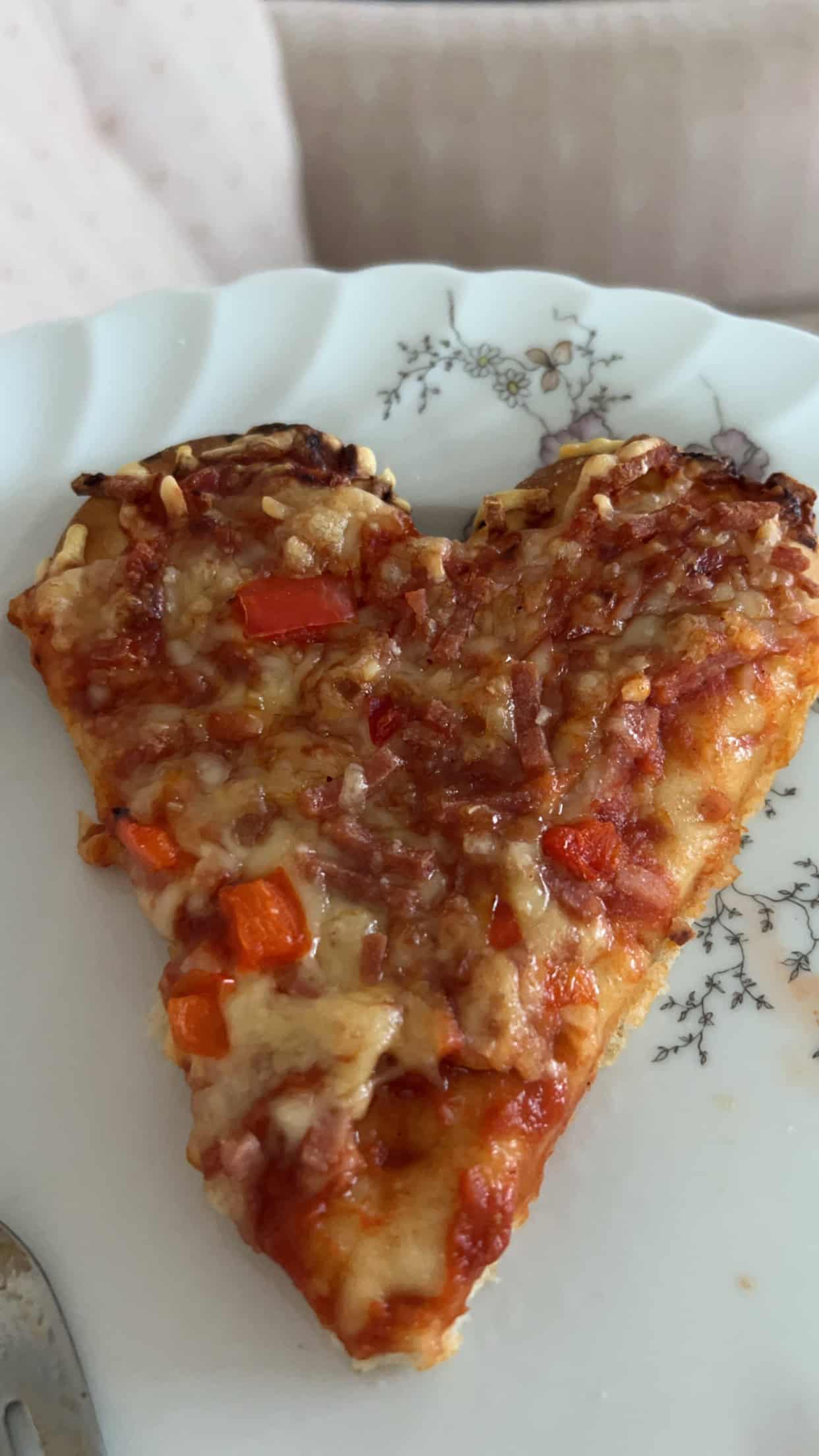 Heart shaped slice of pizza