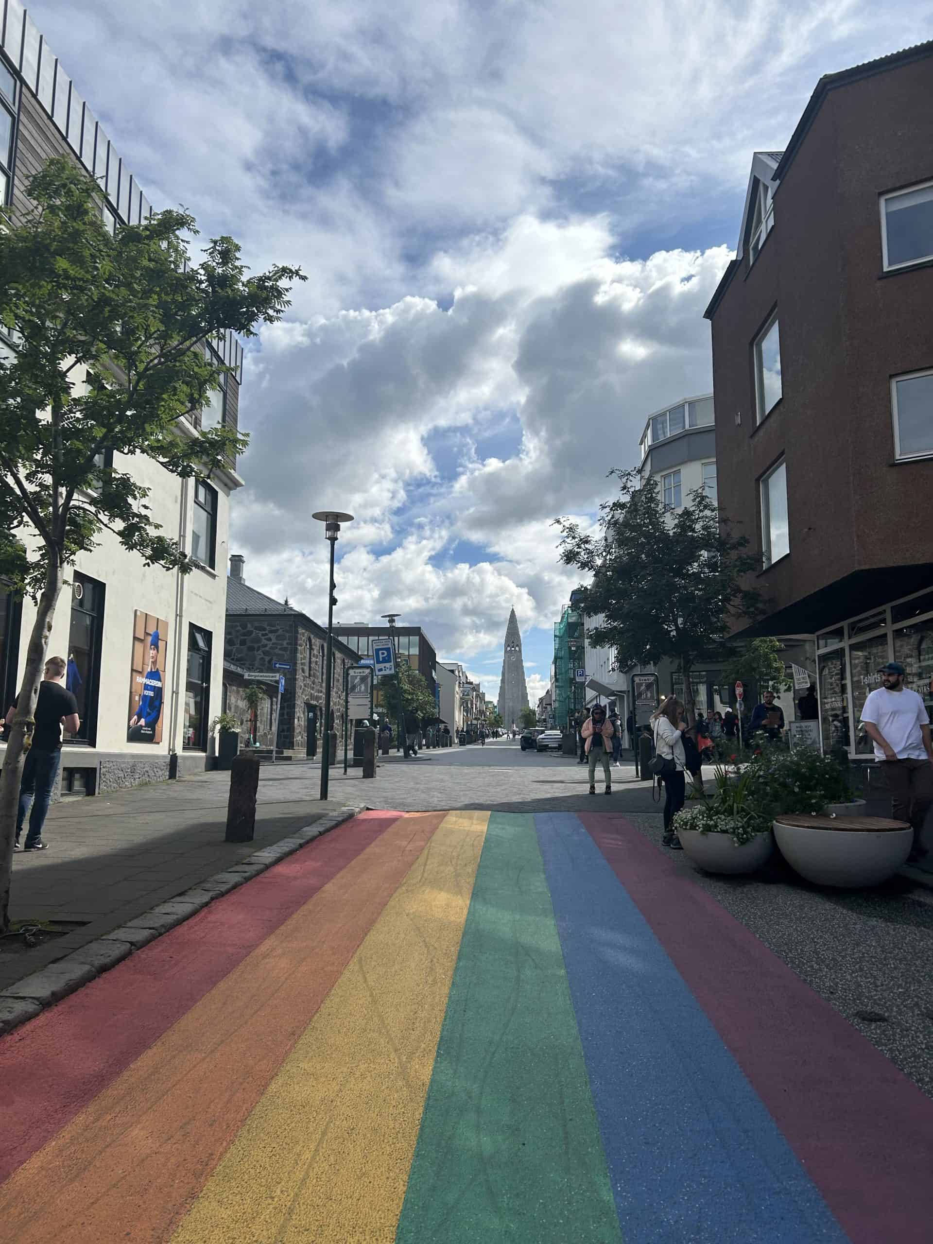 Rainbow street in Reykjavik with shops on either side. 
