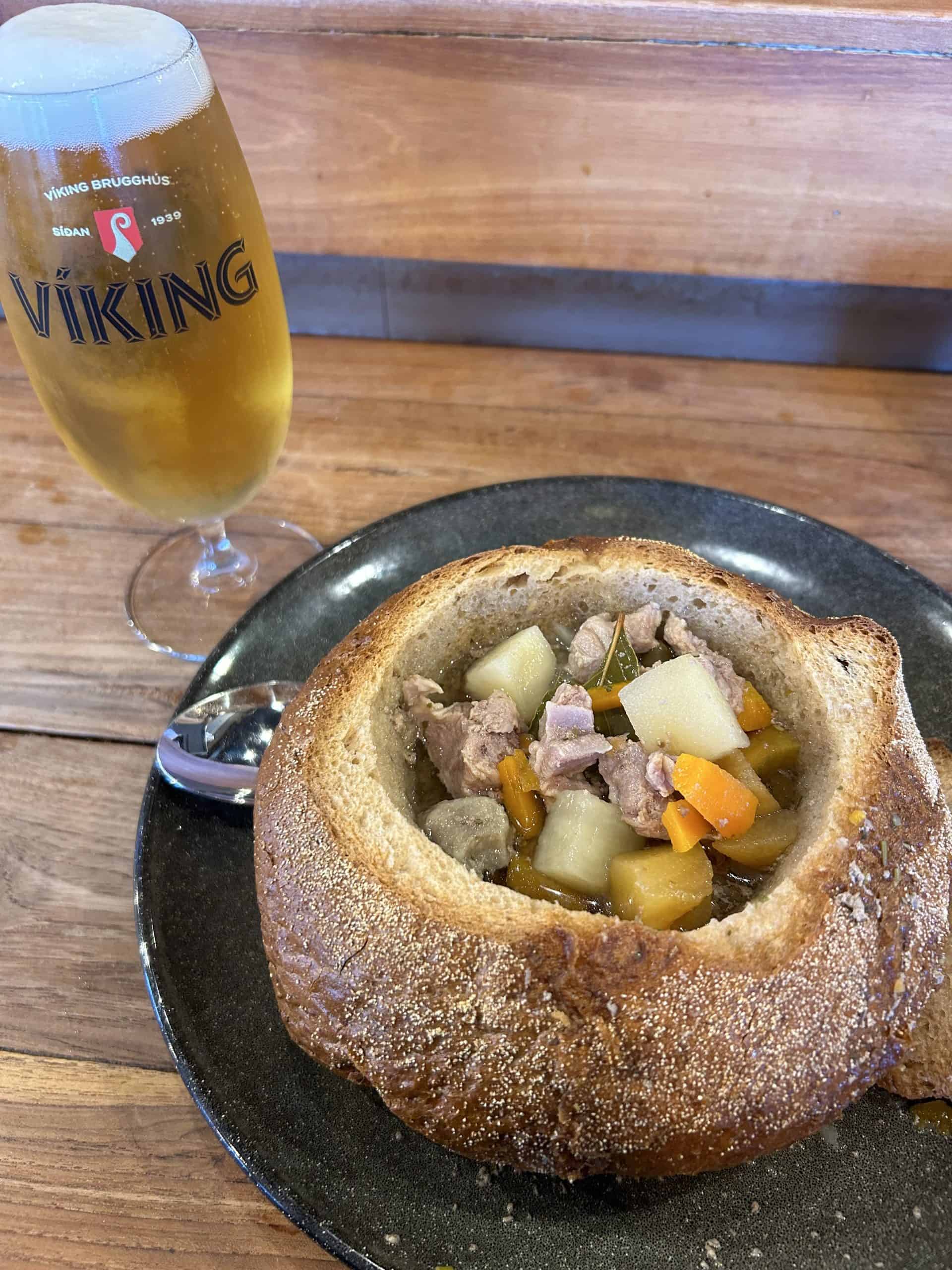 Bread bowl with lamb stew and beer. 