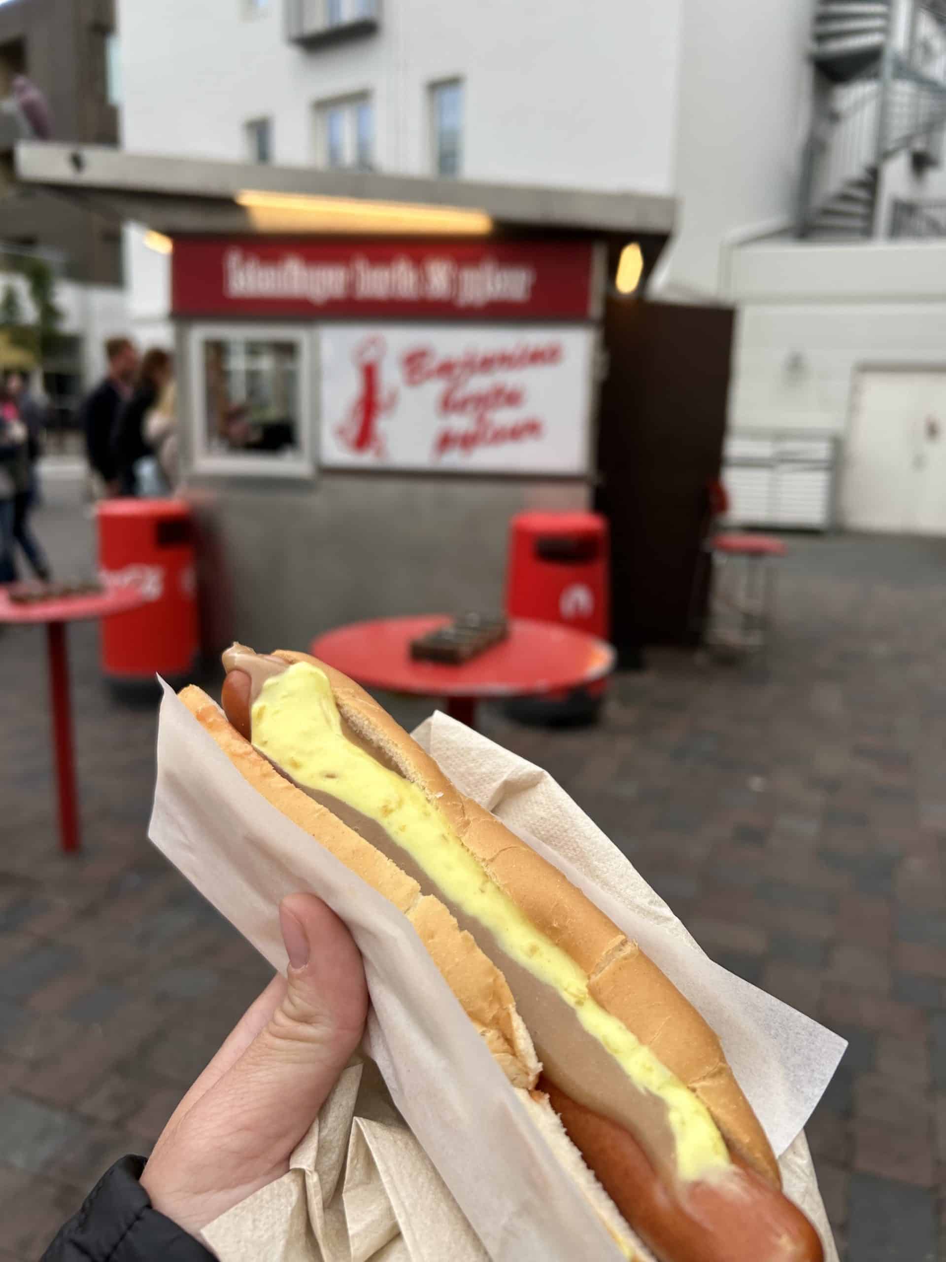 Hot dog with yellow sauce from Baejarins Best hot dog stand. 